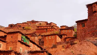 a group of buildings on top of a mountain at Dar Megdaz in Megdaz