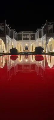 a large white building with lights in the dark at villa blanche Marrakech in Marrakech