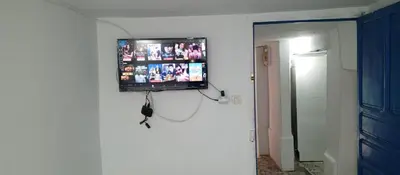 a flat screen tv on a wall in a room at Moulay Idriss in Moulay Idriss Zerhoun