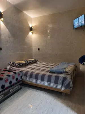 a bedroom with two beds in a room at Moulay Idriss in Moulay Idriss Zerhoun