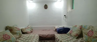 a room with a couch with pillows on it at Moulay Idriss in Moulay Idriss Zerhoun