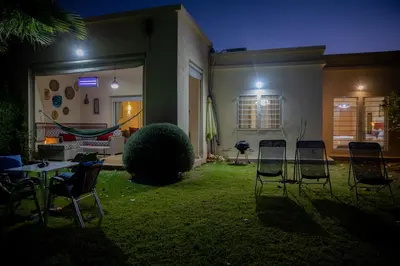 a group of chairs sitting in the yard of a house at ROYAL GOLF DE FES in Fès