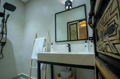 a bathroom with a sink and a mirror at Just V hotel & Spa in Marrakech