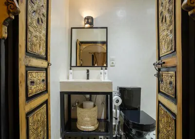 a bathroom with a sink and a mirror at Just V hotel & Spa in Marrakech