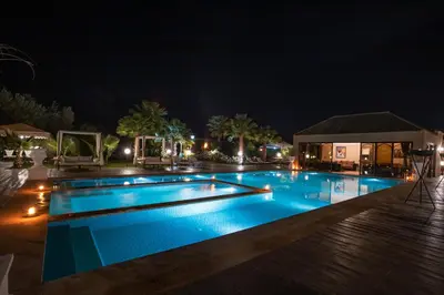 a swimming pool at night at Just V hotel & Spa in Marrakech