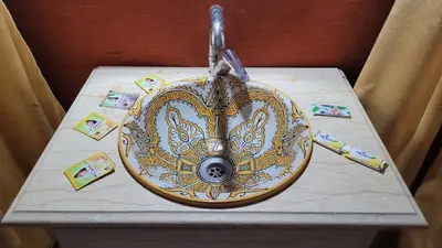a table with a fancy sink on top of it at Africa Magic Camp in Merzouga