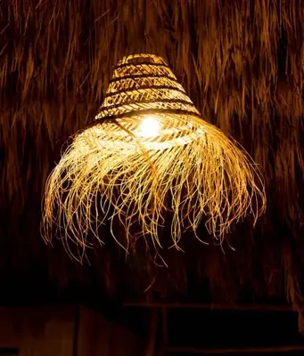 a light that is hanging from a ceiling at Sahara Luxury Camp in Merzouga