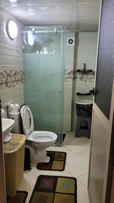 a bathroom with a toilet and a shower and a sink at Charme & Confort au Cœur de Meknes in Meknès