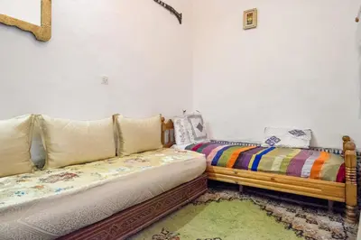 a room with two couches sitting next to each other at Dar Fatimazahra in Fès