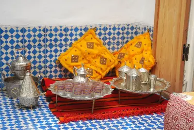 a table with two trays of food on it at Dar Fatimazahra in Fès