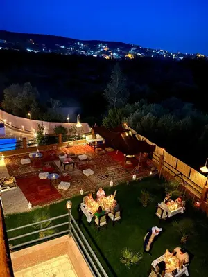 an aerial view of a backyard at night at Riad Sahara Stars Dades in Boumalne