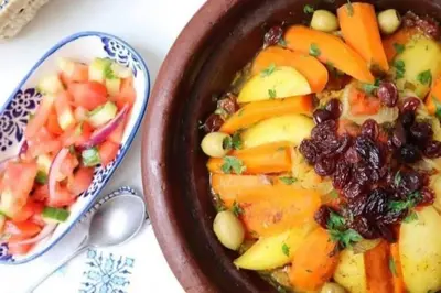 a bowl of food next to a bowl of vegetables at Camel Experience Camp in Merzouga