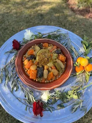 a bowl of food on a plate on a table at Villa privée dans un environnement idyllique in Marrakech
