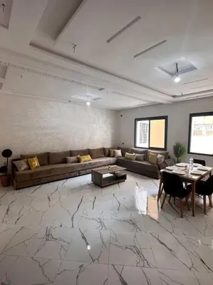 a living room with a couch and a table at Family confort Fes in Fès