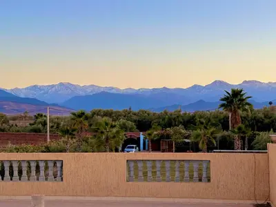 a view of the mountains from the roof of a house at Maison Dar Zarka in Aghmat