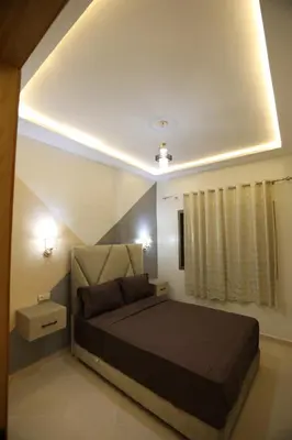 a bedroom with a large bed in a room at مولاي يعقوب in Fès
