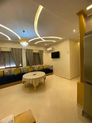 a living room with a couch and a table at مولاي يعقوب in Fès