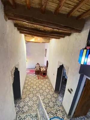 an overhead view of a hallway in a house at chez aubazine in Merzouga