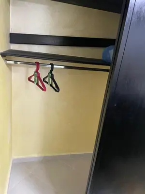 two pairs of scissors hanging on a shelf at Cozy Downtown Apartment in Fès