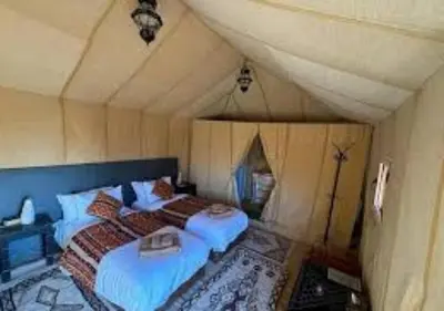 a bedroom with two twin beds in a attic at Morocco travel activities in Merzouga