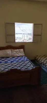 a bedroom with a bed and a window in it at hotel atlas in Imilchil