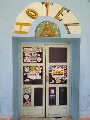 a door in a building with stickers on it at hotel atlas in Imilchil