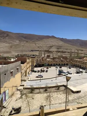 a view from a window of a parking lot at hotel atlas in Imilchil