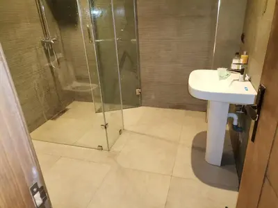 a bathroom with a shower and a sink at زاوية سيدي عبد السلام افران in Ifrane