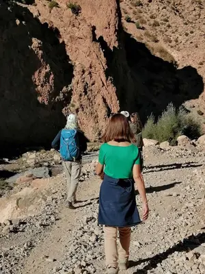 a group of people walking through a canyon at Gite chez Ali Agouti Maison Berbère in Agouti