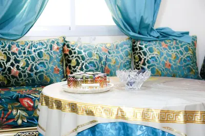 a table with jars on top of a couch at Elhachimi two bedroom with air conditioning in Er Rachidia