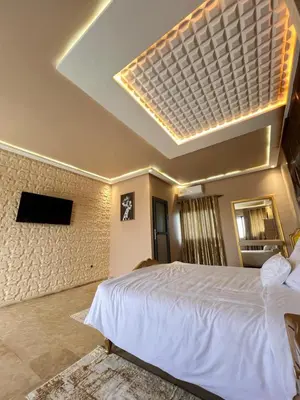 a bedroom with a large white bed in a room at Auberge Salle billionaire in Fès