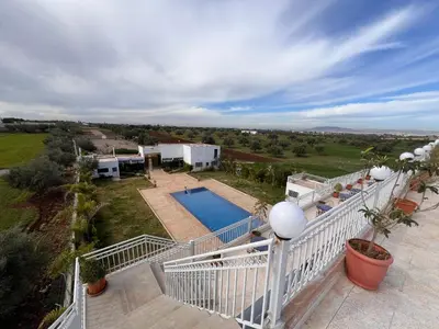 an aerial view of a house with a swimming pool at Auberge Salle billionaire in Fès
