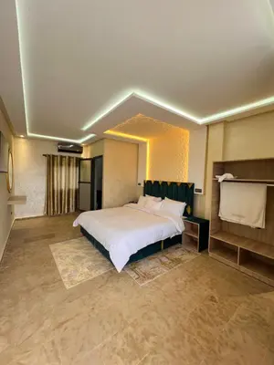 a large bedroom with a large white bed in it at Auberge Salle billionaire in Fès