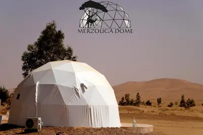 a dome in the middle of the desert at Merzouga Dome in Merzouga