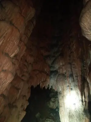 an entrance to a cave with ice formations at Gite Ain Bechar in Taza