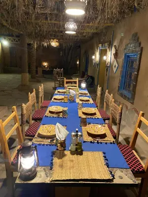 a long table with plates of food on it at kasbah luna del sur in Erfoud