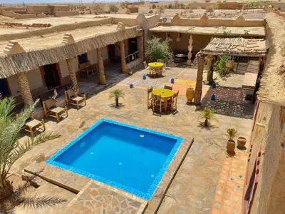 an aerial view of a resort with a swimming pool at kasbah luna del sur in Erfoud