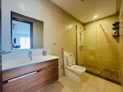 a bathroom with a toilet and a sink and a shower at Paradise Prestigia Fes City Center sur Parc in Fès