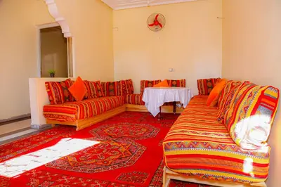 a living room with a couch and a table at Wadahab House An Ideal Retreat for Families and Friends in Er Rachidia