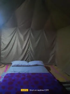 a bedroom with a bed in a tent at Trek Plan Camp in Mhamid