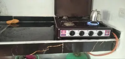 a stove with a pot sitting on top of it at Familles avec bébé in Fès