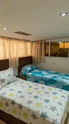 a bedroom with two beds with blue sheets and stars at Dar Benjelloun in Fès