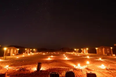 a street at night with a lot of lights at Mhamid Nomad Camp in Mhamid