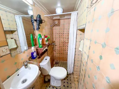 a small bathroom with a toilet and a sink at Dar Houda in Fès