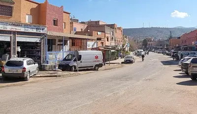 a city street with cars parked on the side of the road at Hôtel&Restaurant Villa des étoiles in Ourika