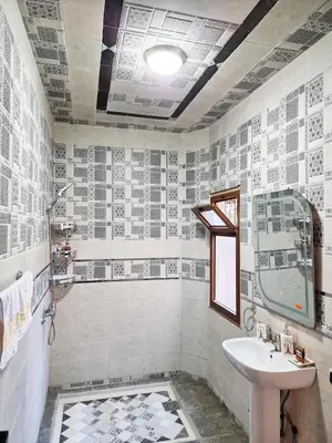 a bathroom with a sink and a shower and a toilet at Hôtel&Restaurant Villa des étoiles in Ourika