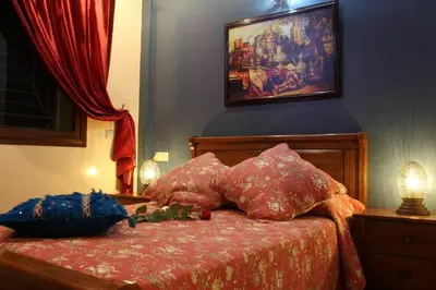 a bedroom with a bed with two pillows on it at Riad Mimosa in Fès