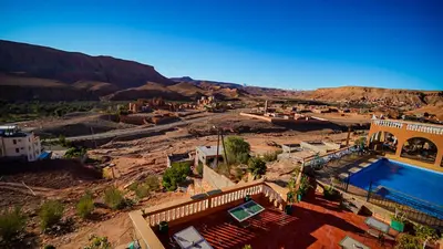 an aerial view of a resort with a swimming pool at Riad Tamdakhte in Aït Ben Haddou