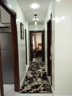 a hallway with a door and a rug at Heaven of Fes in Fès