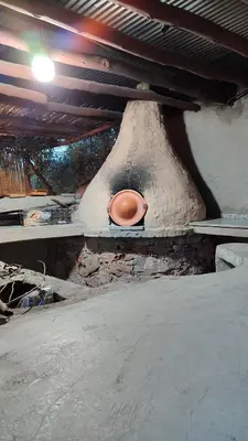 a stone oven with a pot on top of it at Oumnia12 in Fès